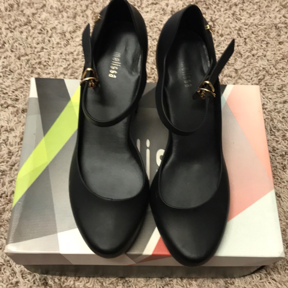 Black Melissa shoes with gold metallic heel